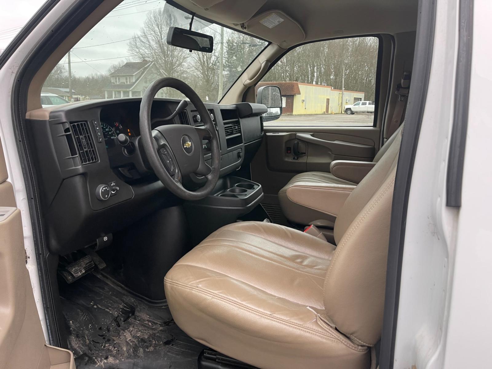 2014 White /Neutral Chevrolet Express 1500 AWD Cargo (1GCSHAF4XE1) with an 5.3L V8 OHV 16V FFV engine, 4-Speed Automatic transmission, located at 547 E. Main St., Orwell, OH, 44076, (440) 437-5893, 41.535435, -80.847855 - This 2014 Chevrolet Express 1500 Cargo Van with a 5.3L Vortec V8 engine and all-wheel drive is a versatile and robust vehicle designed to meet various transportation and towing needs. It comes equipped with convenient features such as power windows, power locks, and a backup camera for safer reversi - Photo #17